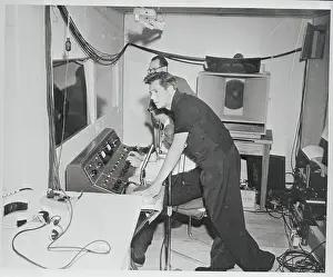 Desi Arnaz Leaning Over Broadcast Panel