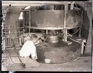 D.H. Sloan Kneeling by 85 Ton Magnet