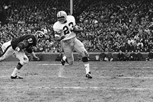 Dick Butkus Charges at Running Back With Football
