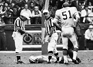Professional Prints: Dick Butkus Watches as Chuck Hughes Lies on Field