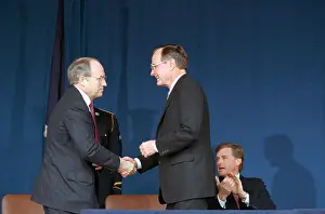 Prints of (Original Caption). Washington: Rep. Dick Cheney, (R-Wyo.), listens to remarks made by President Bush prior to being sworn in as defense secretary a the Pentagon Cheney Uncovered: Political Portraits: Dick Cheney and George Bush Shaking Hands