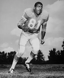 Dick Lane Running in Football Uniform