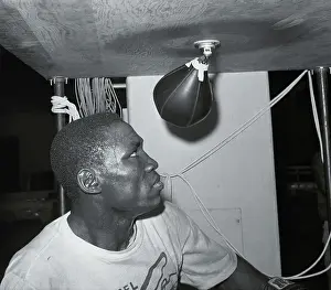 Dick Tiger Practicing on Punching Equipment