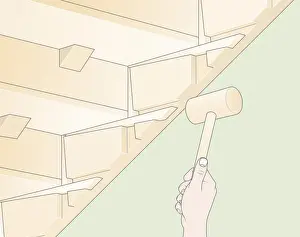Mallet Prints: Digital Illustration of using mallet to tap loose wedges back into place below staircase tread