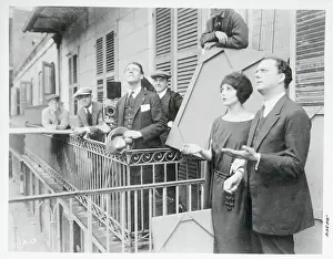 Director and Performers Completing Scene on Balcony