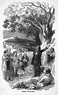 Distant Wagon Train Behind Preaching Man