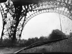 Distortion Prints: Distorted View of Eiffel Tower Through Windshield