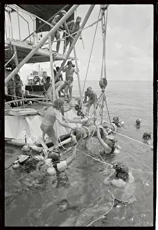 Key West Prints: Divers and Workers Hoisting Cannon