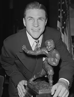 Doak Walker Posing with Heisman Trophy