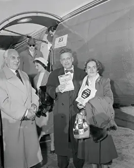 Alfred C Prints: Doctor Alfred Kinsey and his wife Holding up Book