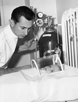 Doctor Checking Infant in Mask
