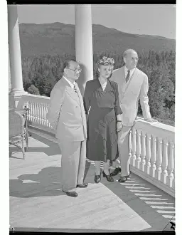 Doctor and Couple Standing on Veranda