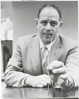 Doctor Displaying Curette