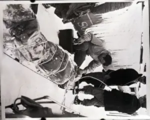 Doctor Examines Man from Snowbound Train