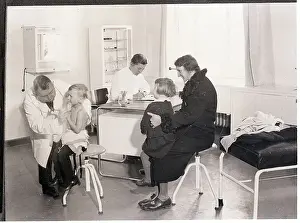 Examination Prints: Doctor Examining Children for Tuberculosis