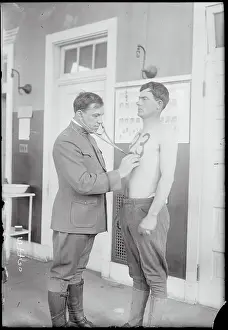 Doctor Examining Soldier on Base