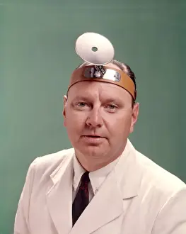 Doctor Prints: Doctor Portrait Head Shoulder Wearing Opthalamoscope Diagnostic Tool Doctors Health Physician Healthcare