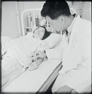 Doctor Practicing Acupuncture on Patient