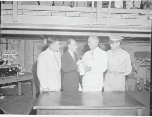 Oak Ridge Prints: Doctor Presenting Container of Isotopes