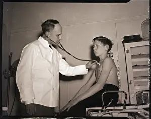 Doctor Prints: Doctor Using Stethoscope on Boy Patient