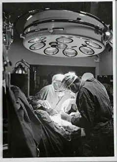 Doctors Performing Surgery in Operating Room