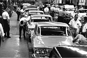 Prints of Auto experts give attention to the most minute detail in the final inspection of Dodge cars before they are driven from production line in the Dodge Assembly Plant in Detroit. Lancer and Dart lines Timeless Moments: A Visual Journey Through History’s Defining Images: Dodge Cars Coming Off Assembly Line in Detroit