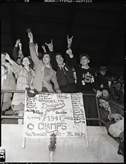Dodgers Fans In The Bleachers With Sign