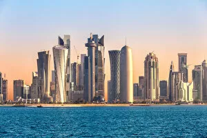 Blue Sky Gallery: Doha skyline and harbor at sunset, Qatar, Middle East
