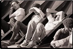 Exhausted Prints: Dominican Refugees Rest on Ship Deck