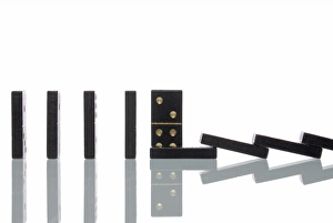 Domino stepping out of line, thus preventing the other dominos from falling Domino stepping out of line, thus preventing the other dominos from falling