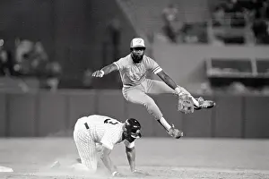 Don Baylor Jumps Over Ken Griffey