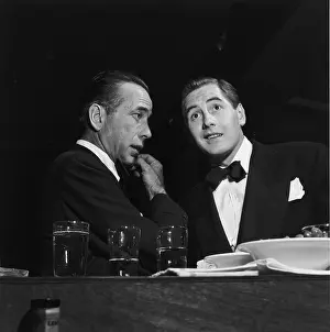 Prints of 1948: EXCLUSIVE American actors Humphrey Bogart (1899 - 1957) and Don Taylor (1920 - 1998) talk at a Redbook magazine award party for the film industry, Hollywood, California. (Photo by M) The Essence of Cool: Don And Humphrey