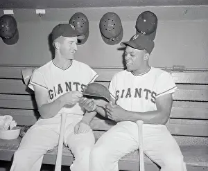 Don Mueller and Willie Mays Holding Sides of Helmet