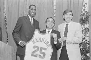 Don Sterling Holding a Basketball Jersey