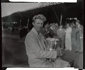 Donald Budge Holding Trophy