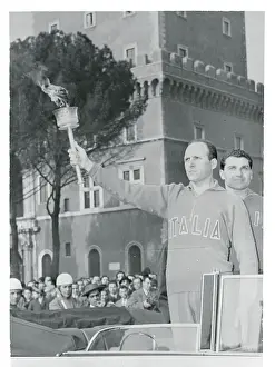 Dordoni Holding the Olympic Torch