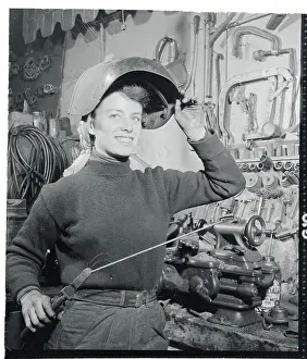 Doris Lang Working on a Car