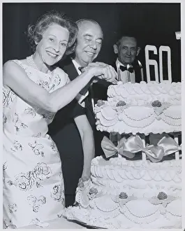 Dorothy and Richard Rodgers Slicing Birthday Cake