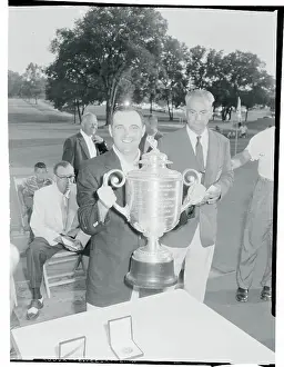 Doug Ford Holding His Trophy Cup