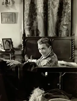 Douglas Fairbanks in Costume on Bed