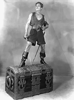 Boots Prints: Douglas Fairbanks Standing on Chest