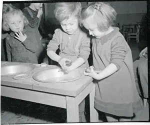 Clean Prints: DP Children Learning to Use Soap