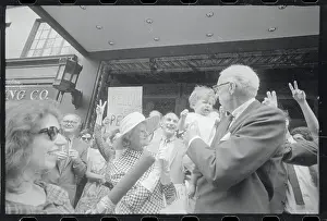 Dr. Benjamin Spock Holding a Baby