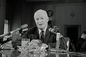Dr. Brock Chishelm Sitting at Microphones