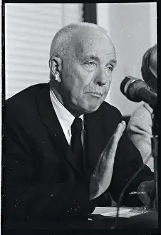 Dr. Charles B. Huggins Gesturing to Press