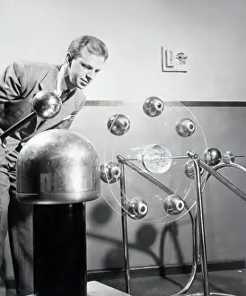 Displaying Prints: Dr. Fitz-Hugh Marshall Demonstrating a Particle Accelerator