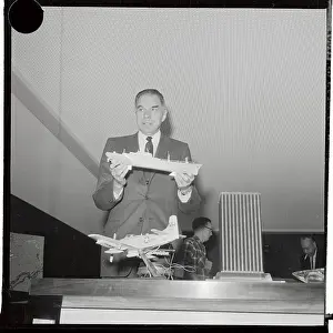 Dr. Glenn T. Seaborg Holding a Model