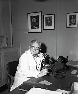 Dr. Harry Zimmerman with Microscope