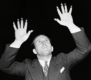 Dr. Irwin Moon with Thimbles on his Fingers