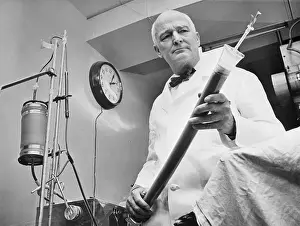 Surgeon Prints: Dr. John H. Gibbon, Jr. Holding Blood Cleaning Apparatus
